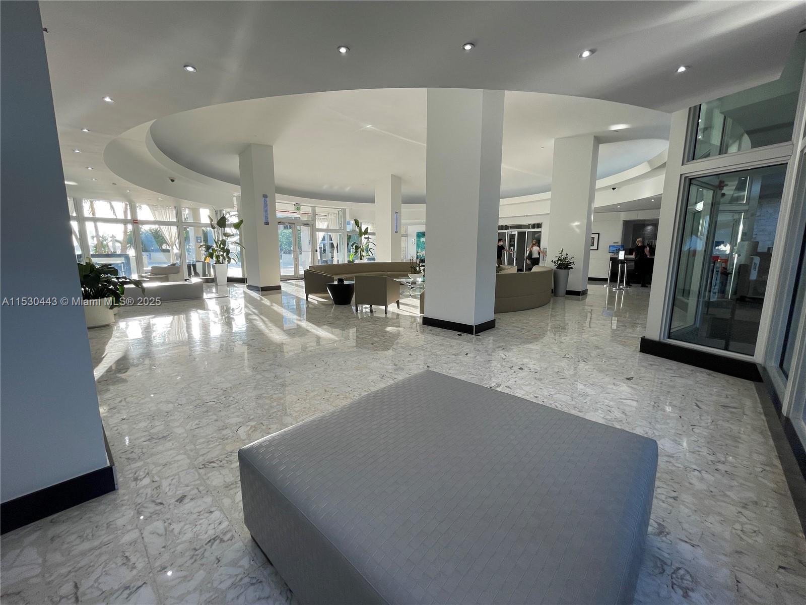 1200 West Avenue, Unit 202 Miami Beach, FL 33139 - Photo 34 of 45 a living room with furniture and a large window