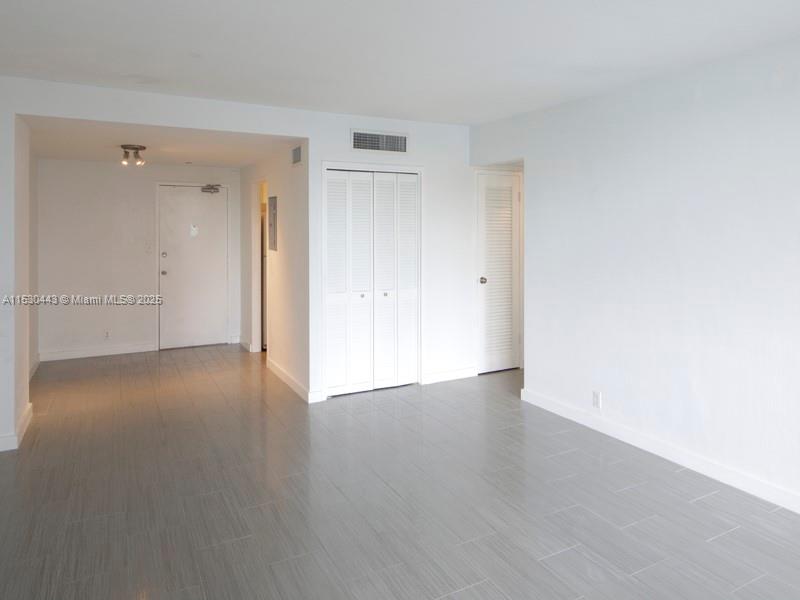 1200 West Avenue, Unit 202 Miami Beach, FL 33139 - Photo 44 of 45 a view of an empty room and wooden floor
