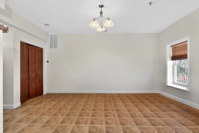 a view of an empty room and window