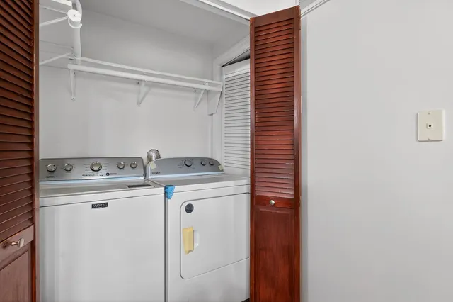 a utility room with dryer and washer