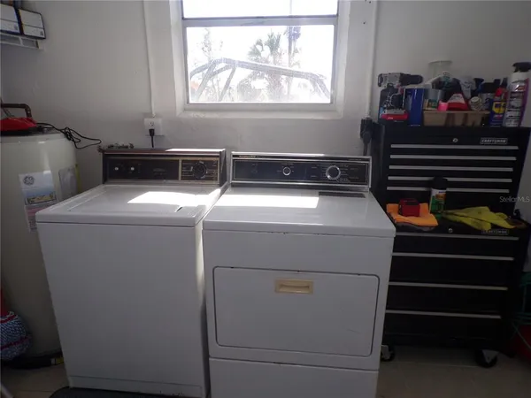 a utility room with dryer and washer