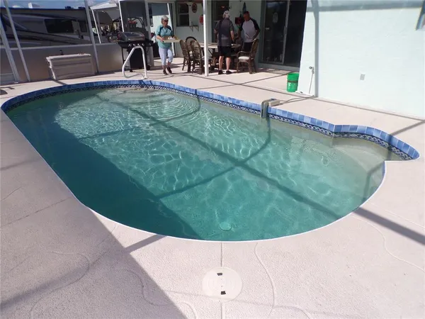 a view of a swimming pool with a patio