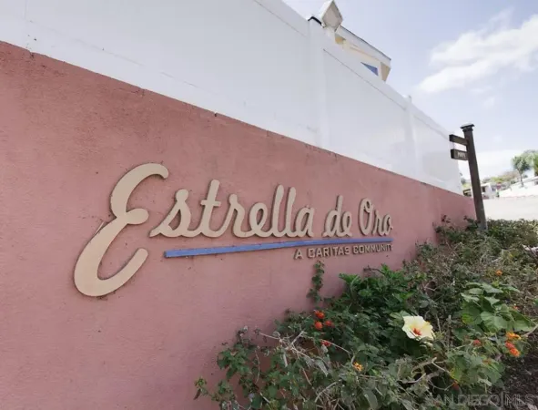 a sign broad in front of a house