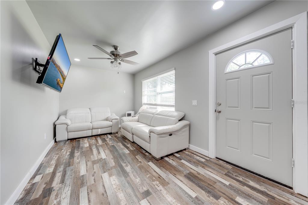 150 North Post Road Kenansville, FL 34739 - Photo 18 of 42 a living room with furniture and a window
