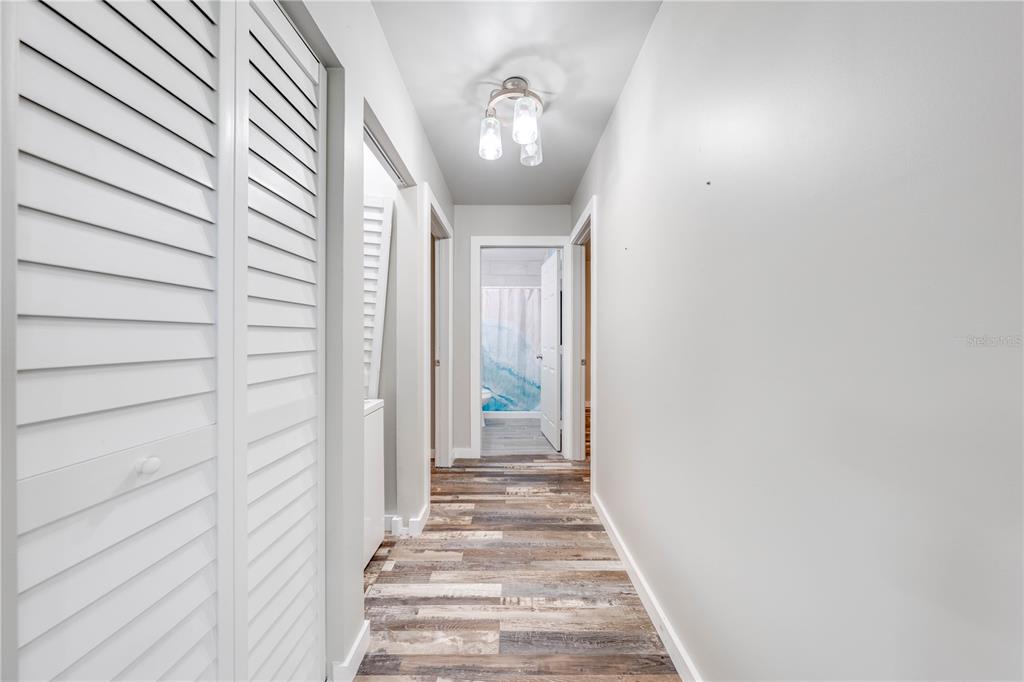 150 North Post Road Kenansville, FL 34739 - Photo 21 of 42 a view of a hallway with wooden floor and entryway