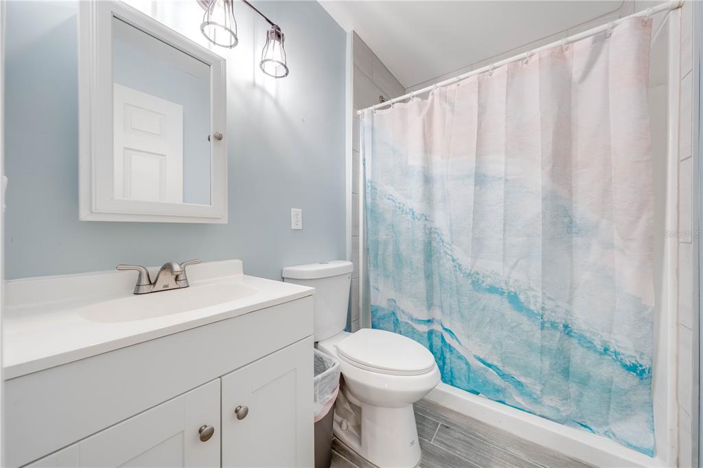 150 North Post Road Kenansville, FL 34739 - Photo 24 of 42 a bathroom with a sink a toilet and shower