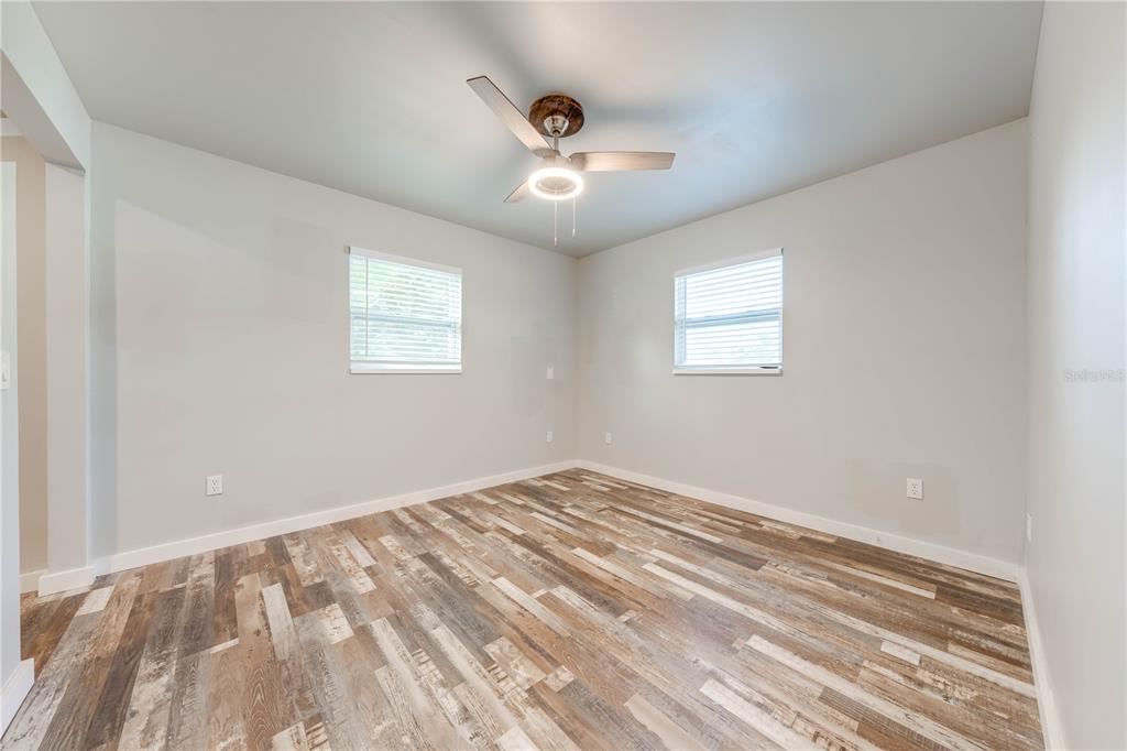 150 North Post Road Kenansville, FL 34739 - Photo 25 of 42 a view of empty room with wooden floor