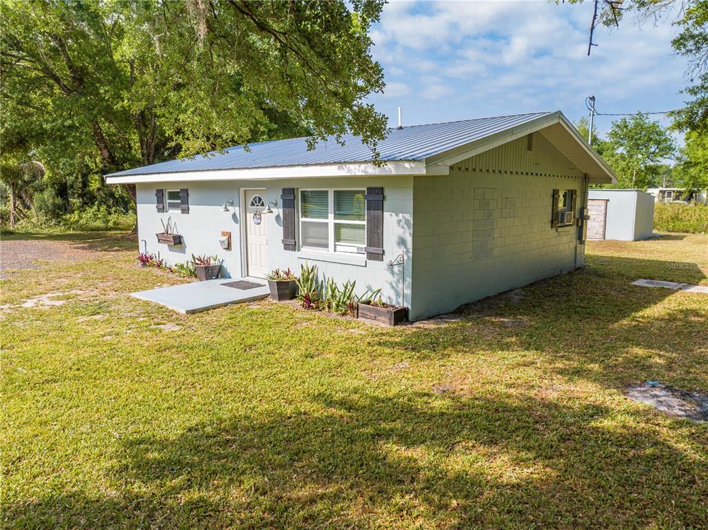 150 North Post Road Kenansville, FL 34739 - Photo 34 of 42 a view of a house with backyard