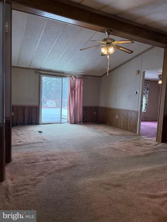 a view of an empty room with a cabinet