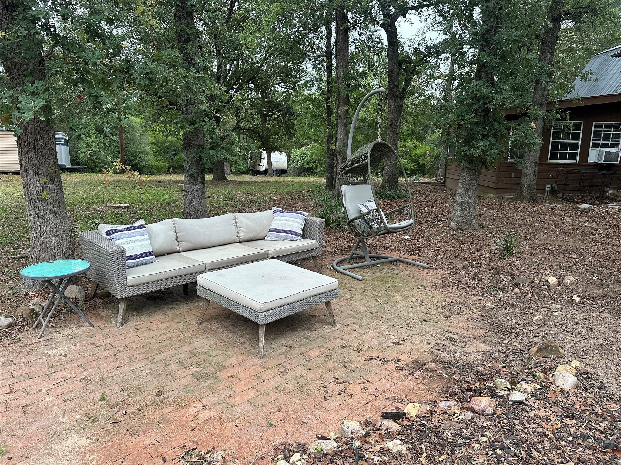 1053 East County Rd F Lexington, TX 78947 - Photo 28 of 38 a view of a yard with furniture and a fire pit
