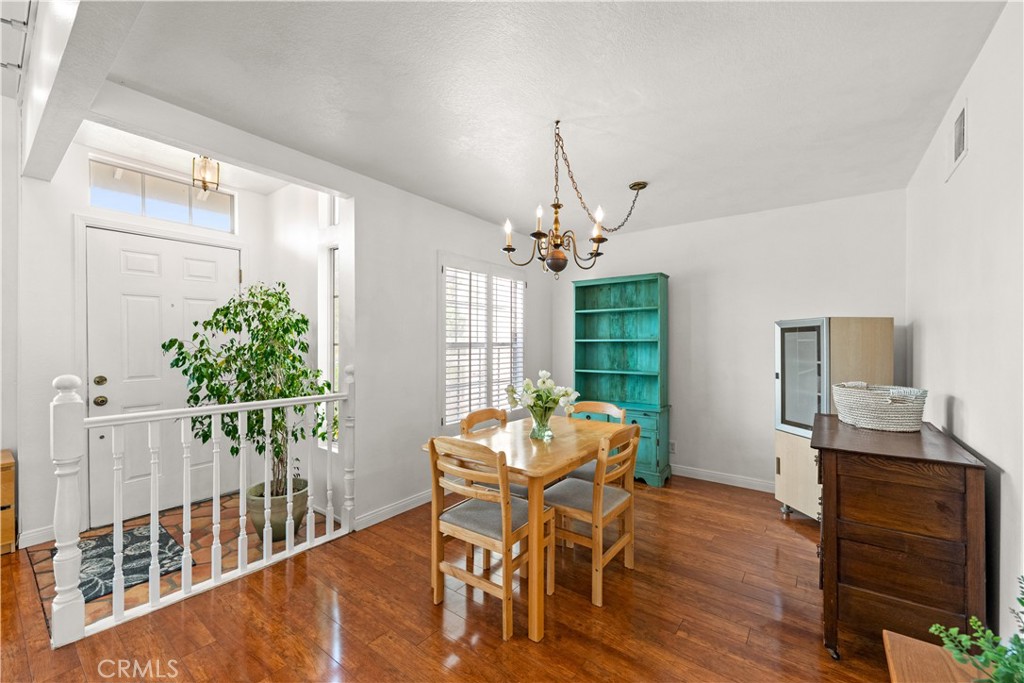 16 Wellesley, Unit 2 Irvine, CA 92612 - Photo 11 of 55 a view of a dining room with furniture window and wooden floor