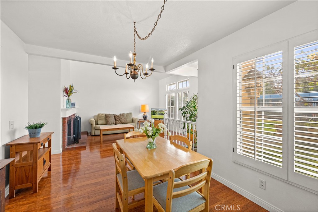 16 Wellesley, Unit 2 Irvine, CA 92612 - Photo 13 of 55 a view of a dining room with furniture window and wooden floor