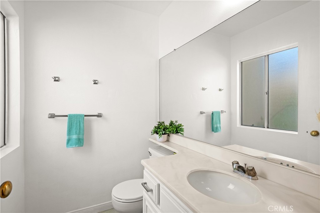 16 Wellesley, Unit 2 Irvine, CA 92612 - Photo 23 of 55 a bathroom with a sink and a mirror