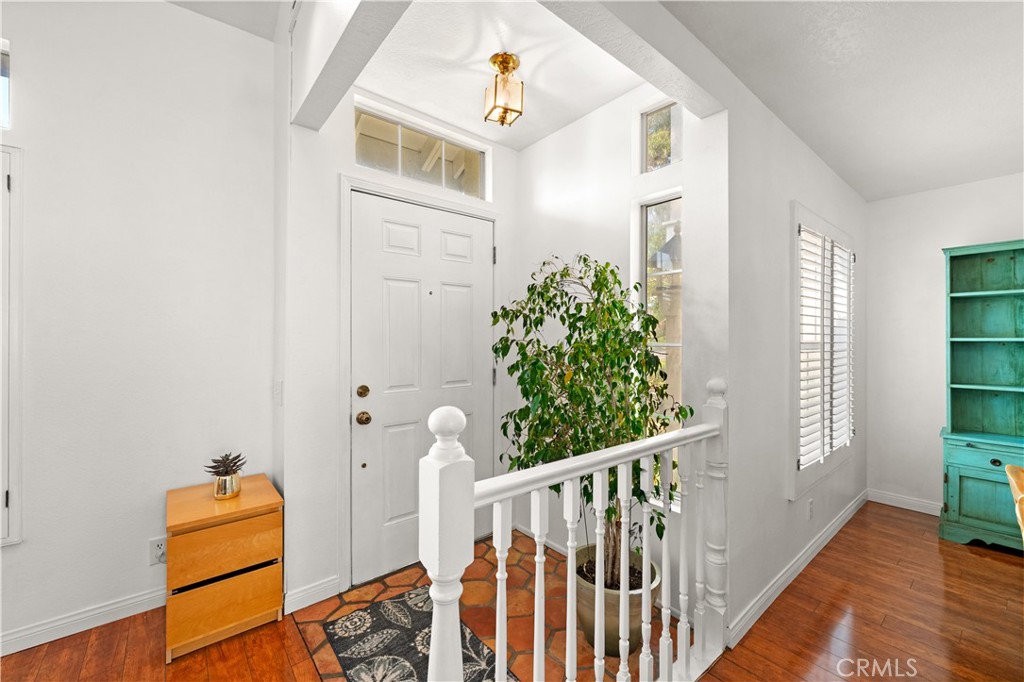 16 Wellesley, Unit 2 Irvine, CA 92612 - Photo 3 of 55 a view of a hallway to a livingroom with furniture