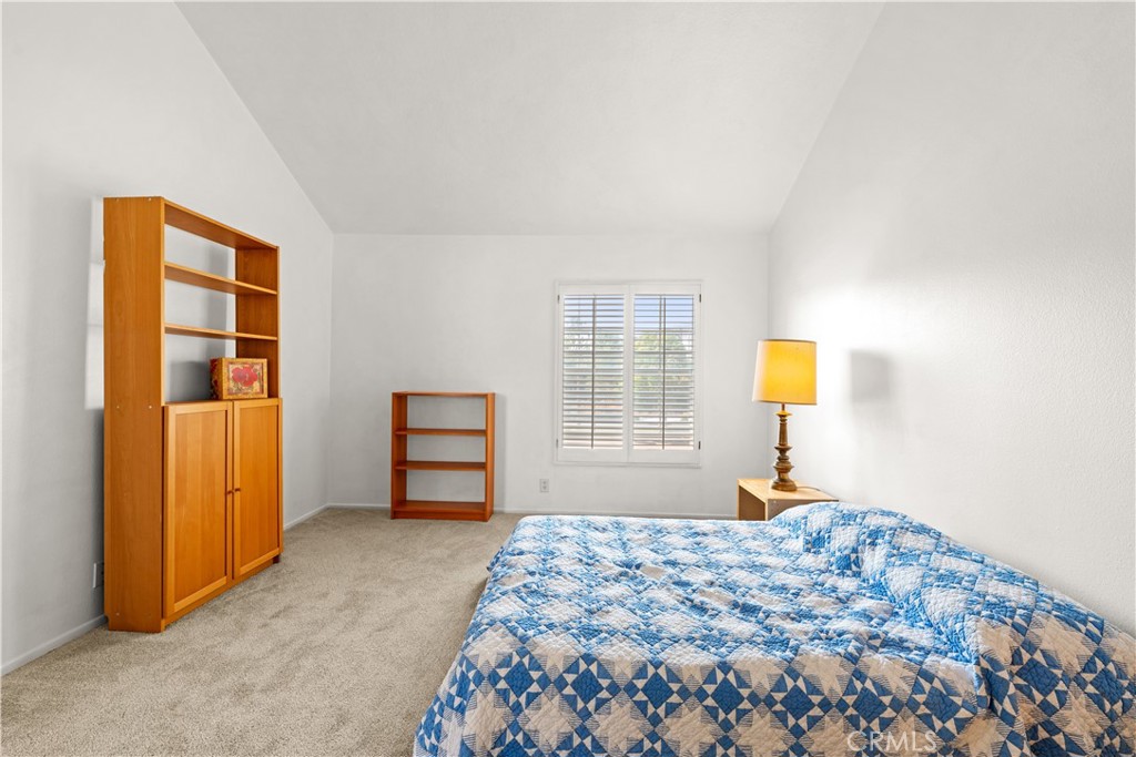 16 Wellesley, Unit 2 Irvine, CA 92612 - Photo 31 of 55 a bedroom with a bed and a window