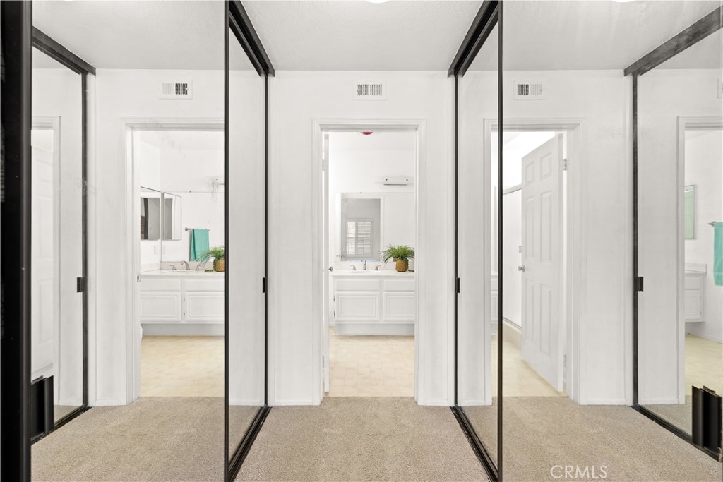 16 Wellesley, Unit 2 Irvine, CA 92612 - Photo 33 of 55 a bathroom with a glass shower door and a mirror