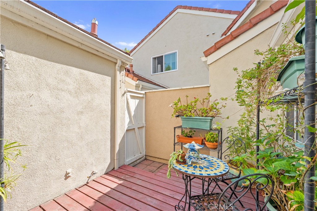16 Wellesley, Unit 2 Irvine, CA 92612 - Photo 37 of 55 a front view of a house with outdoor seating