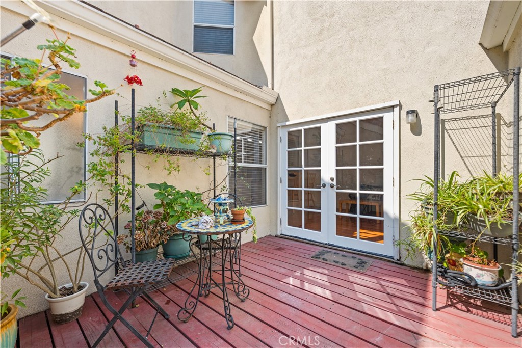 16 Wellesley, Unit 2 Irvine, CA 92612 - Photo 38 of 55 a view of a house with a potted plant and sitting area