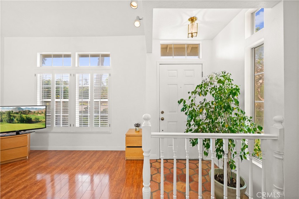 16 Wellesley, Unit 2 Irvine, CA 92612 - Photo 4 of 55 a view of a bedroom with wooden floor and windows
