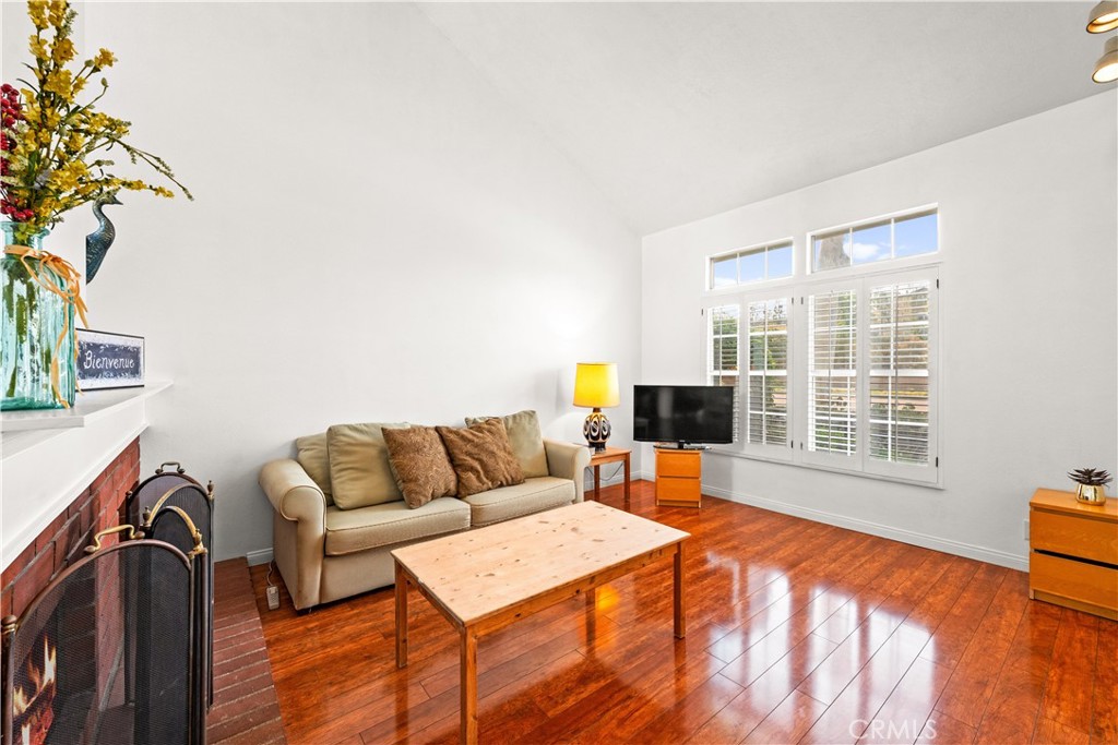 16 Wellesley, Unit 2 Irvine, CA 92612 - Photo 6 of 55 a living room with furniture and a flat screen tv