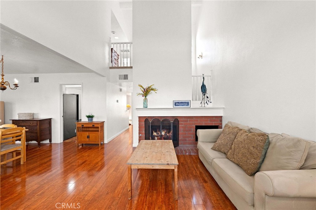 16 Wellesley, Unit 2 Irvine, CA 92612 - Photo 9 of 55 a living room with furniture and a fireplace