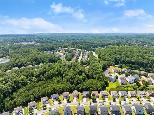 an aerial view of a house with lots of trees