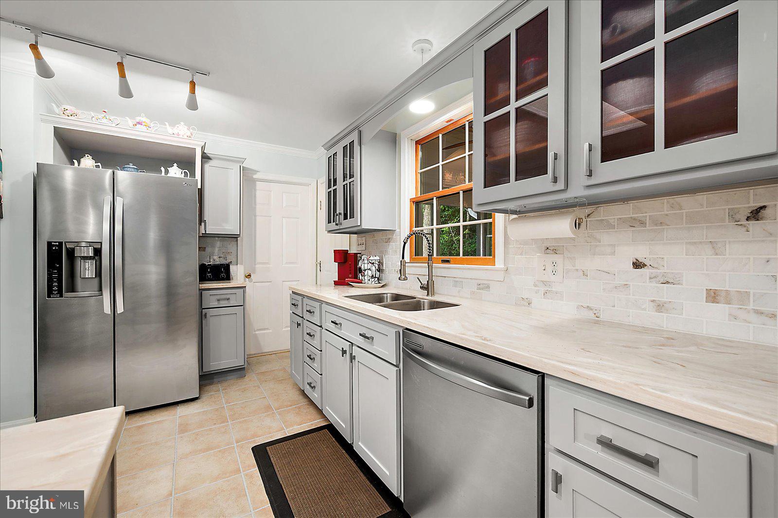101 Sandyhook Road Ocean Pines, MD 21811 - Photo 17 of 64 a kitchen with stainless steel appliances granite countertop a refrigerator and a sink