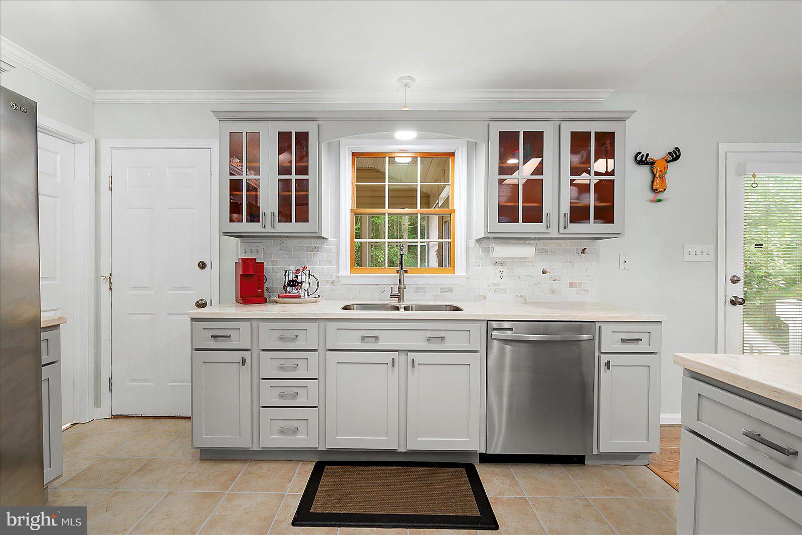 101 Sandyhook Road Ocean Pines, MD 21811 - Photo 18 of 64 a kitchen with cabinets appliances and a window