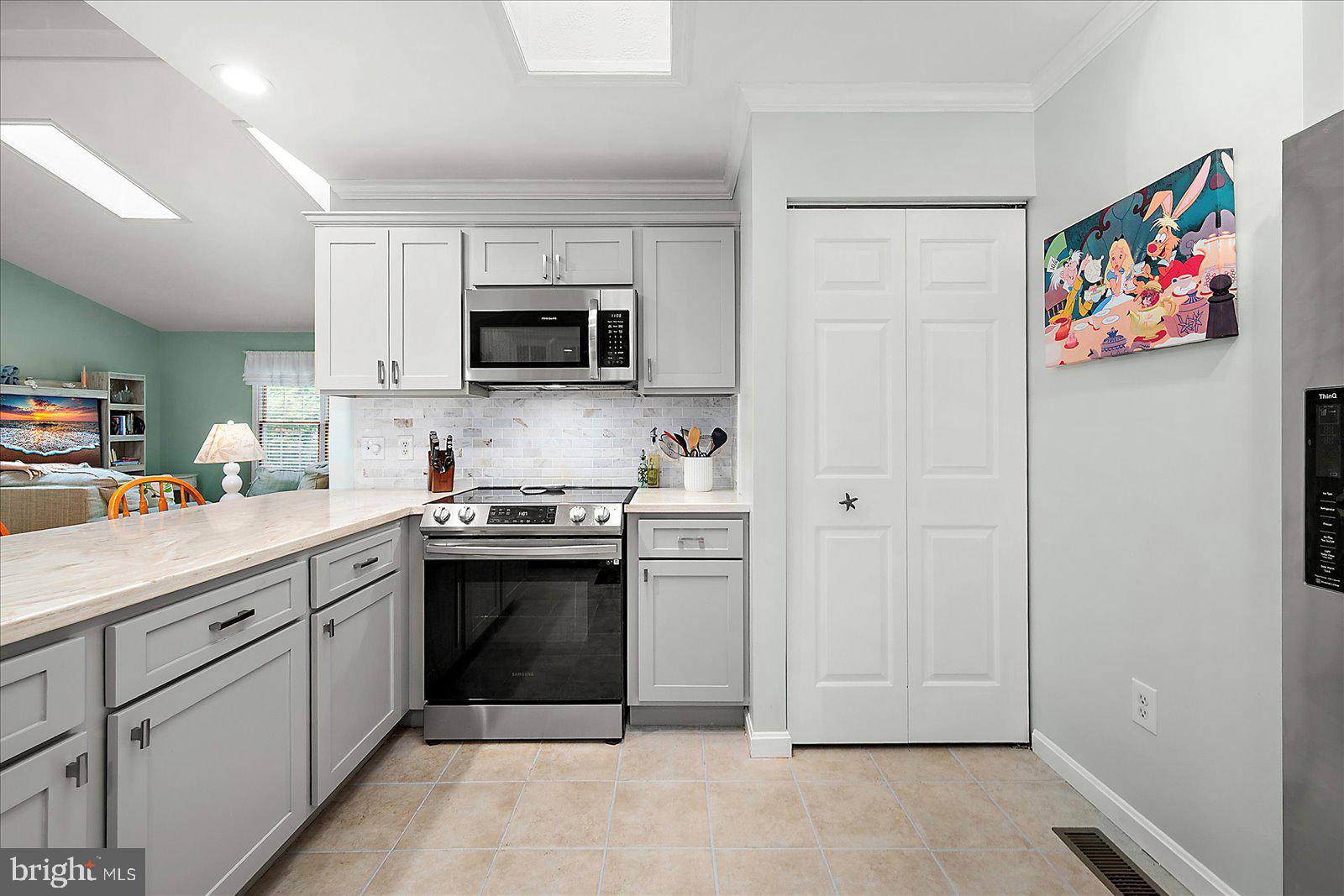 101 Sandyhook Road Ocean Pines, MD 21811 - Photo 20 of 64 a kitchen with stainless steel appliances granite countertop a refrigerator and a sink