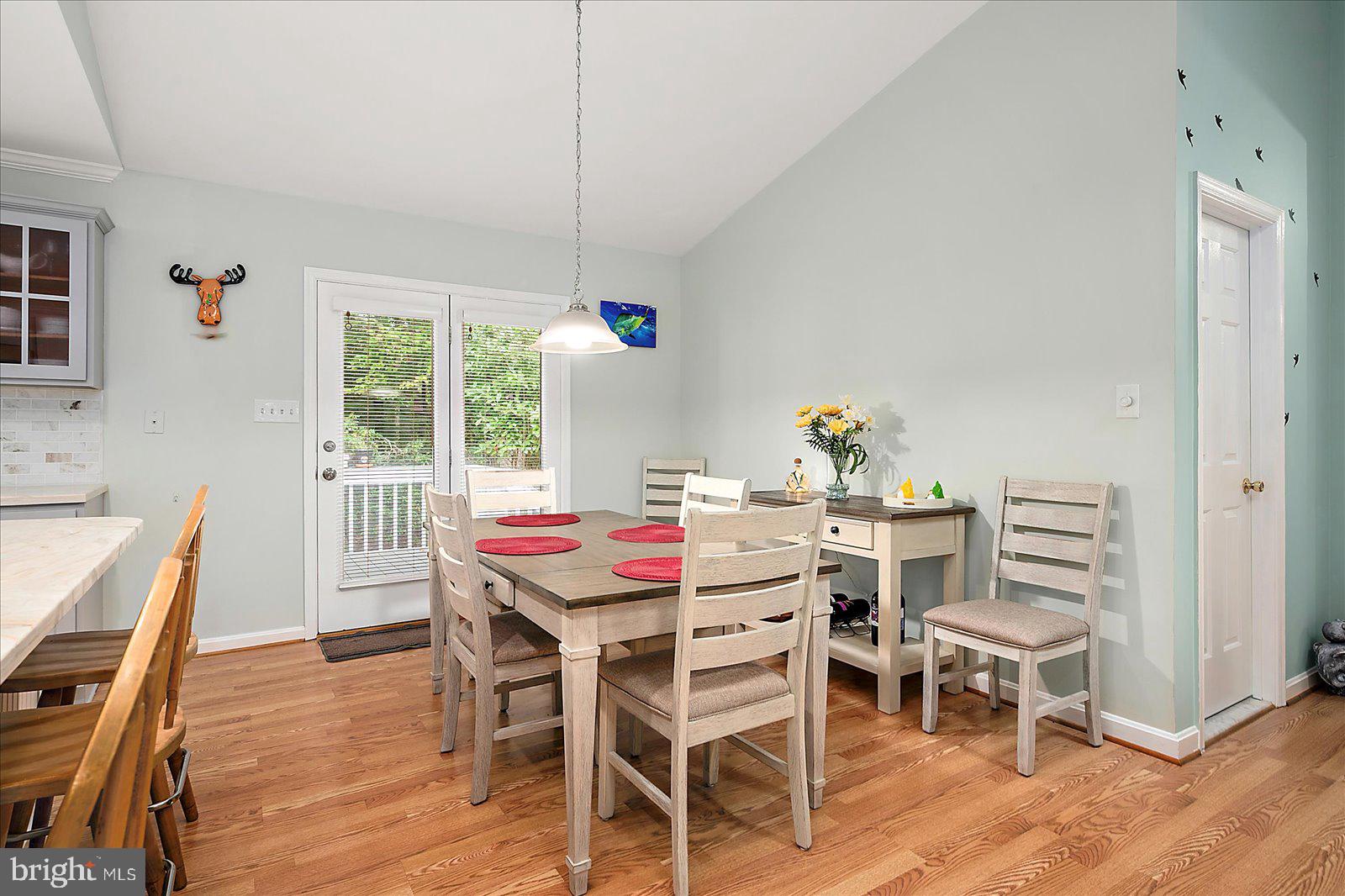 101 Sandyhook Road Ocean Pines, MD 21811 - Photo 23 of 64 a view of a dining room with furniture window and wooden floor