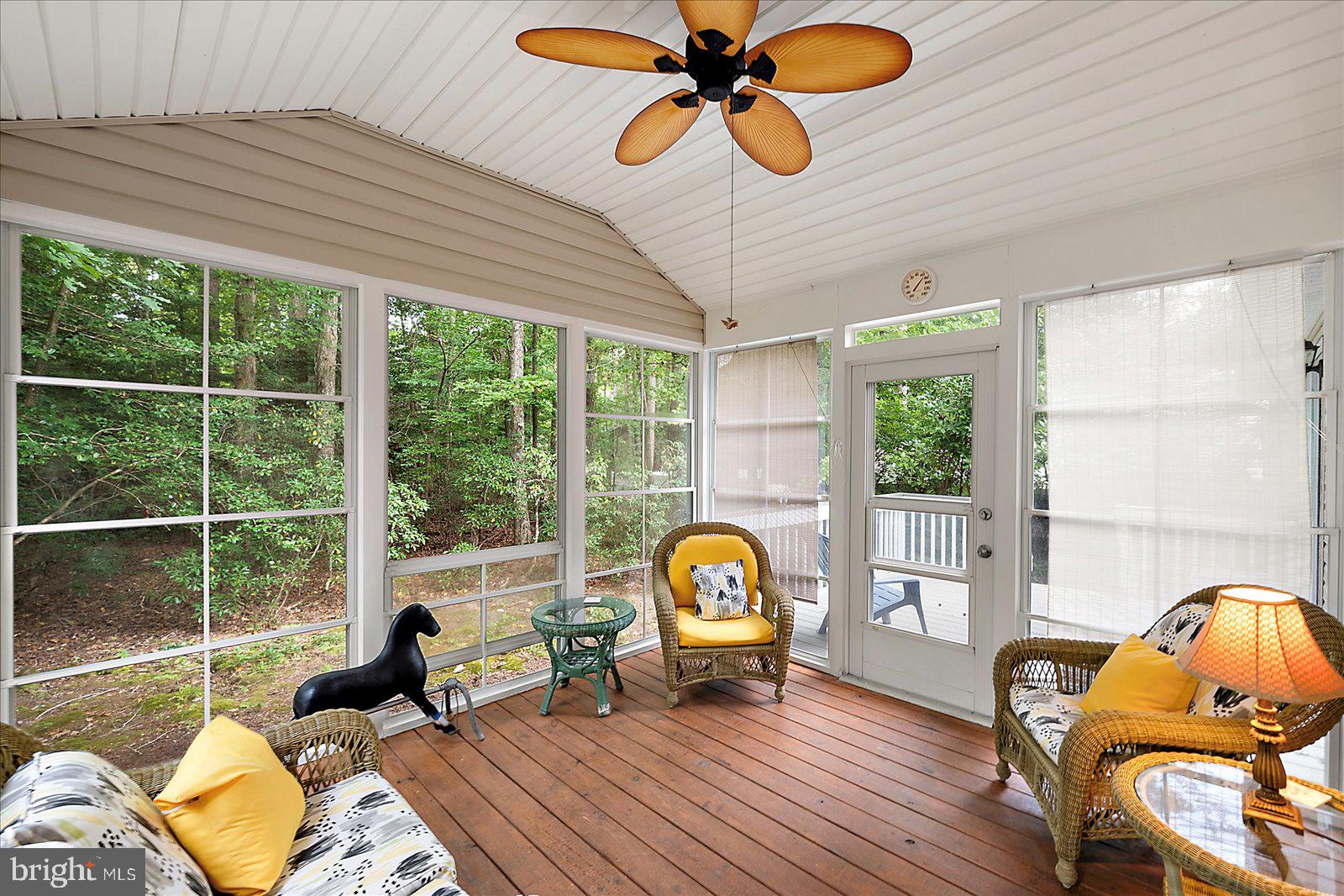 101 Sandyhook Road Ocean Pines, MD 21811 - Photo 36 of 64 a living room with furniture and a floor to ceiling window