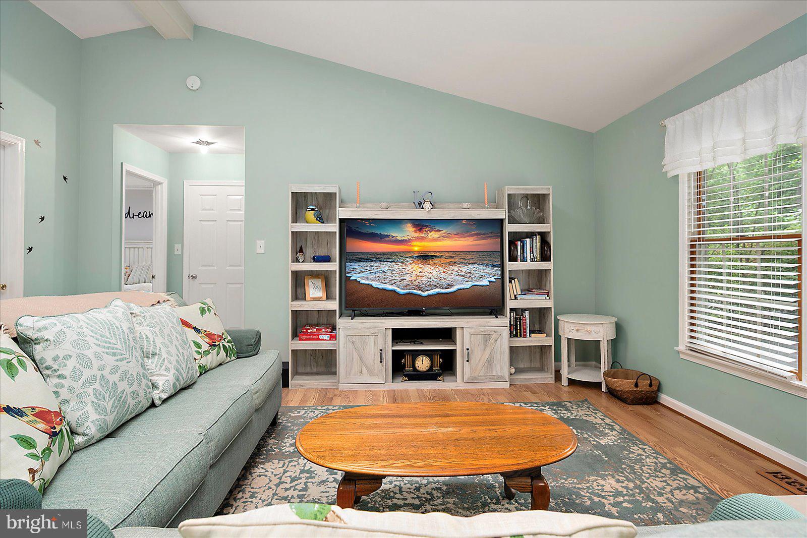 101 Sandyhook Road Ocean Pines, MD 21811 - Photo 8 of 64 a living room with furniture and a fireplace