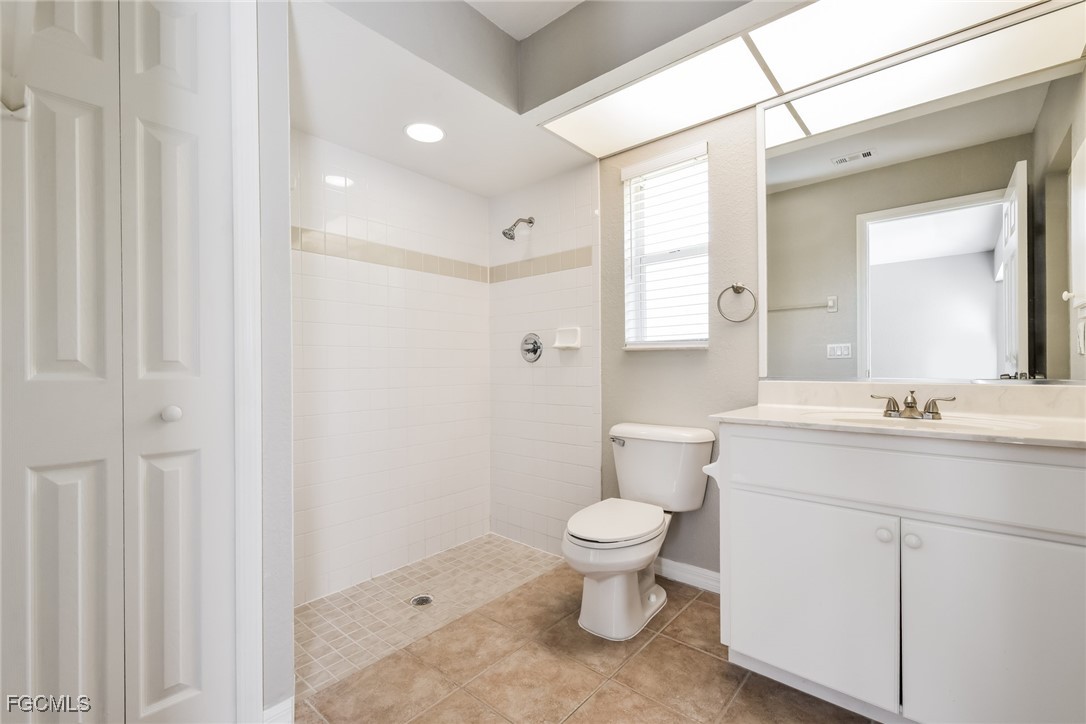 2810 Beloit Terrace North Port, FL 34286 - Photo 11 of 16 a bathroom with a toilet sink a mirror and vanity