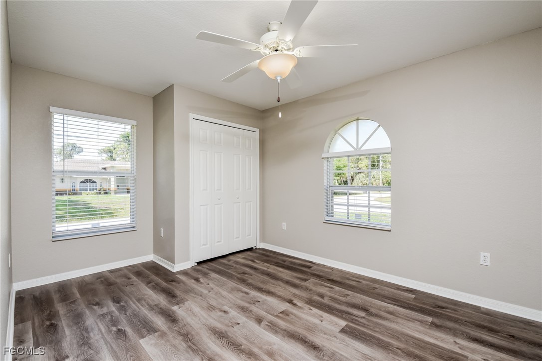 2810 Beloit Terrace North Port, FL 34286 - Photo 13 of 16 a view of an empty room with a window and a chandelier fan