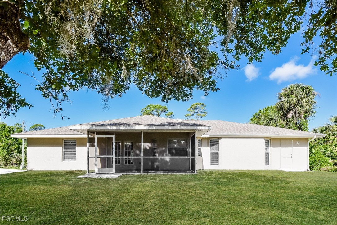 2810 Beloit Terrace North Port, FL 34286 - Photo 15 of 16 a view of a house with a yard and a tree