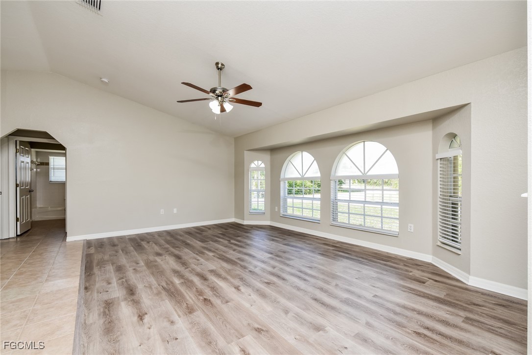 2810 Beloit Terrace North Port, FL 34286 - Photo 4 of 16 an empty room with wooden floor and windows