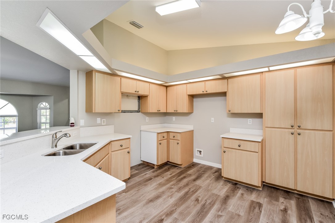 2810 Beloit Terrace North Port, FL 34286 - Photo 7 of 16 a kitchen with white cabinets and sink