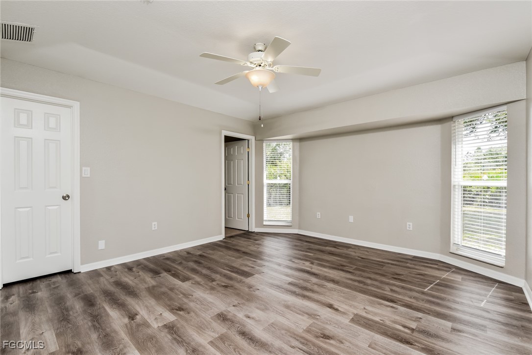2810 Beloit Terrace North Port, FL 34286 - Photo 9 of 16 a view of an empty room with window and wooden floor