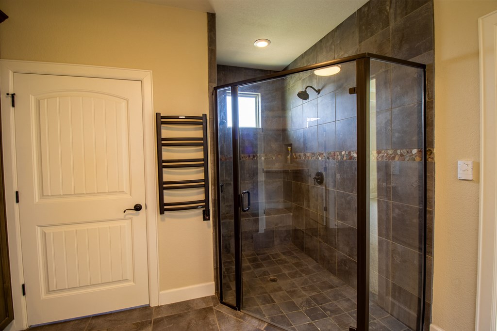 6515 Highway 27 Center Point, TX 78010 - Photo 17 of 48 a bathroom with a shower and a glass door
