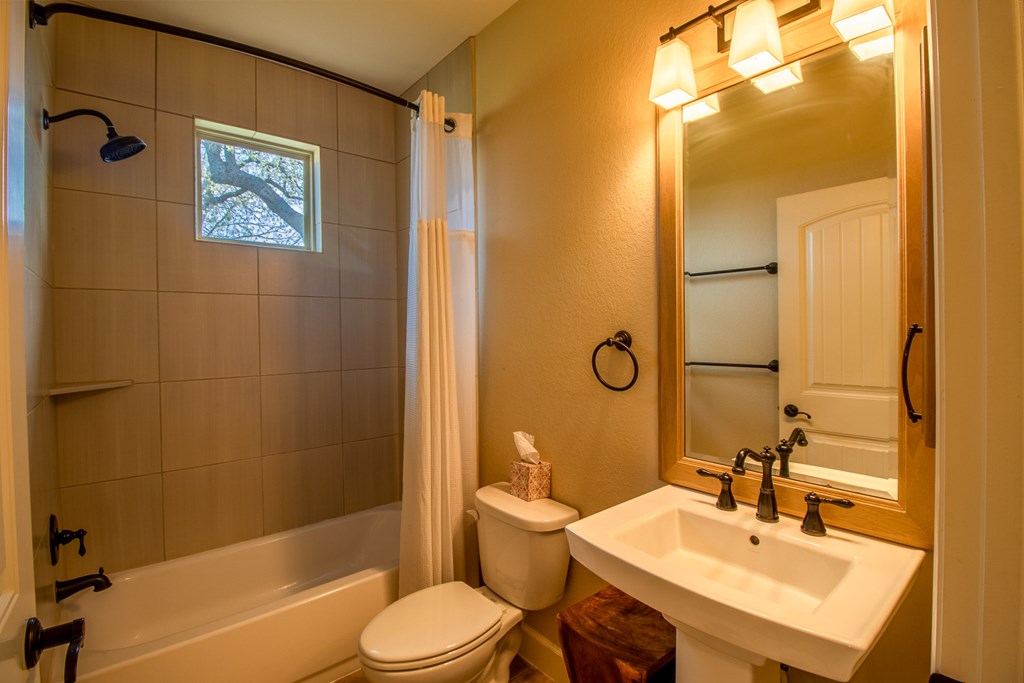 6515 Highway 27 Center Point, TX 78010 - Photo 22 of 48 a bathroom with a sink toilet and shower
