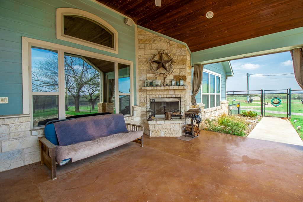 6515 Highway 27 Center Point, TX 78010 - Photo 23 of 48 a outdoor living space with furniture and a fireplace