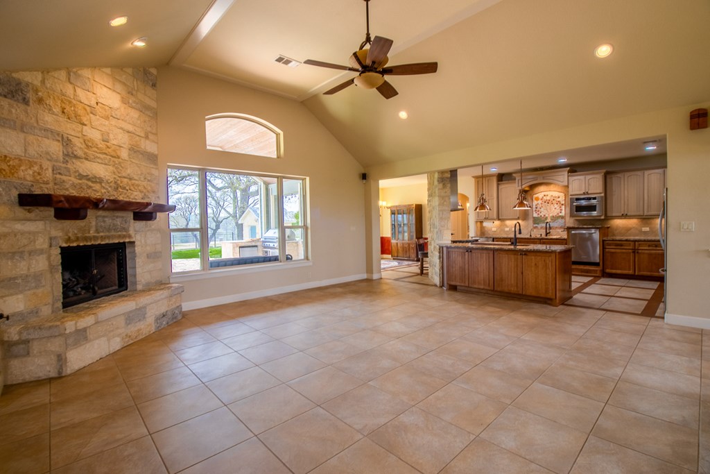 6515 Highway 27 Center Point, TX 78010 - Photo 10 of 48 a large kitchen with stainless steel appliances granite countertop a stove and cabinets