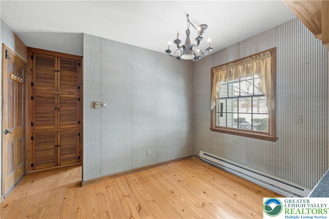 904 Parkway Road Allentown, PA 18104 - Photo 12 of 42 wooden floor in an empty room with a window
