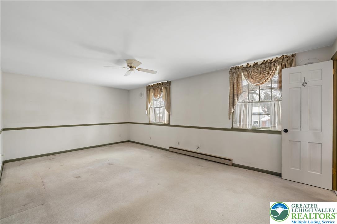 904 Parkway Road Allentown, PA 18104 - Photo 17 of 42 an empty room with windows and closet