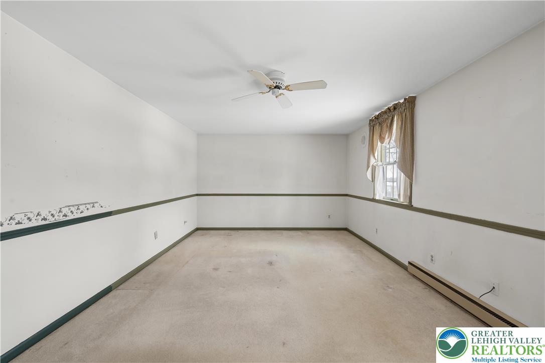 904 Parkway Road Allentown, PA 18104 - Photo 18 of 42 an empty room with windows and fan