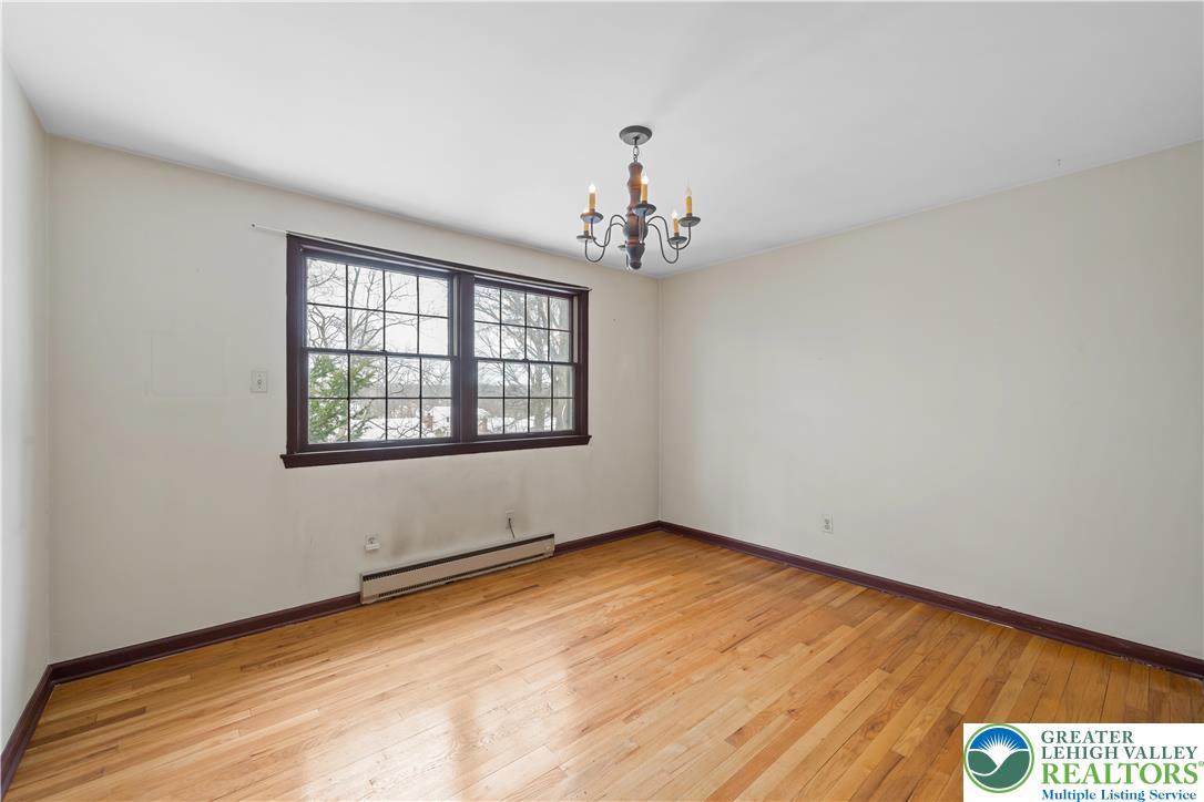 904 Parkway Road Allentown, PA 18104 - Photo 26 of 42 wooden floor in an empty room with a window