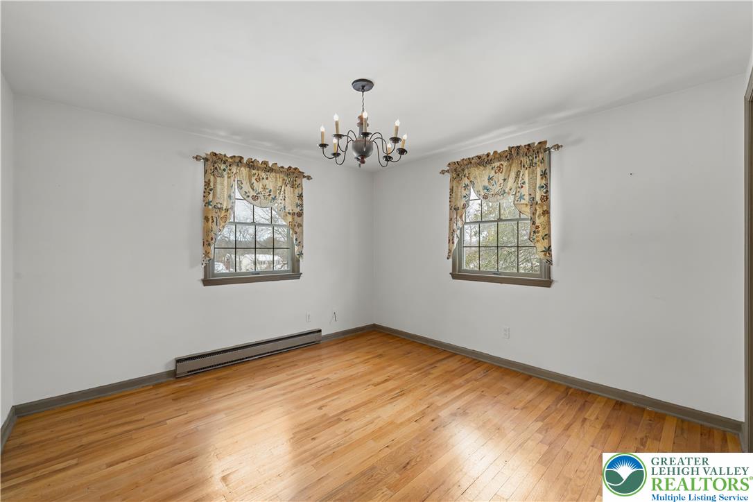 904 Parkway Road Allentown, PA 18104 - Photo 28 of 42 wooden floor in an empty room with a window