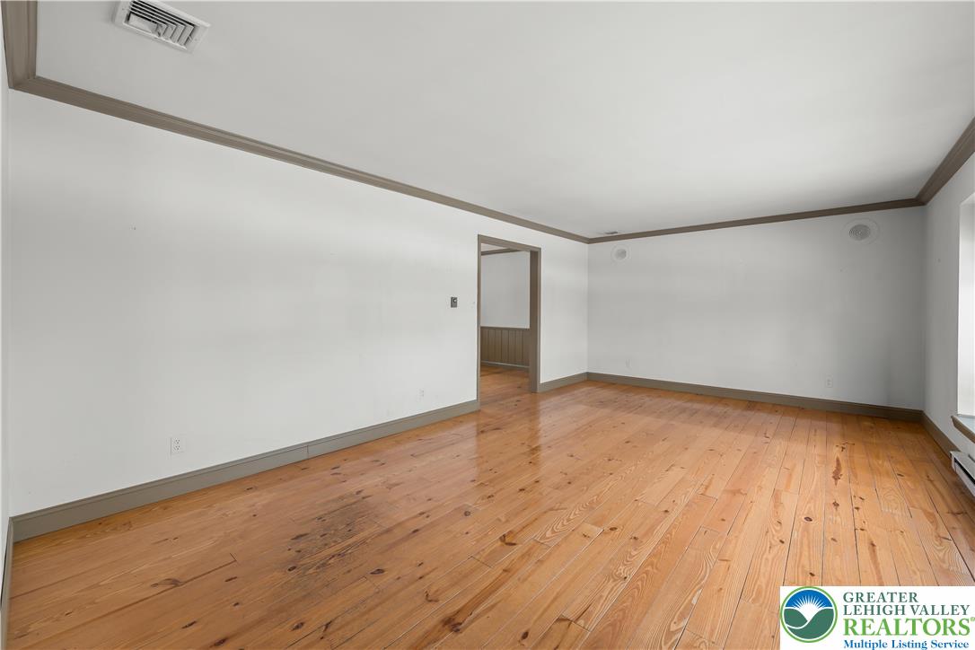 904 Parkway Road Allentown, PA 18104 - Photo 3 of 42 a view of an empty room and wooden floor