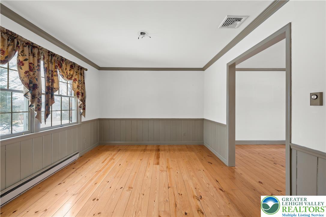 904 Parkway Road Allentown, PA 18104 - Photo 8 of 42 a view of empty room with wooden floor and fan
