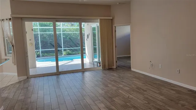 a kitchen with stainless steel appliances granite countertop a stove top oven a sink and a refrigerator